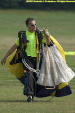 carrying the parachute back to be repacked